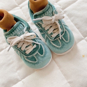 Green velvet sneakers