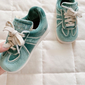 Green velvet sneakers