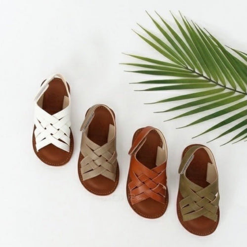 Crossed white sandals
